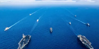 Trump’s Armada Near Iran: Strike Countdown or Negotiation Tactic? The_USS_Dwight_D_Eisenhower_and_USS_USS_Gerald_R_Ford_carrier_strike_groups_in_November_2023