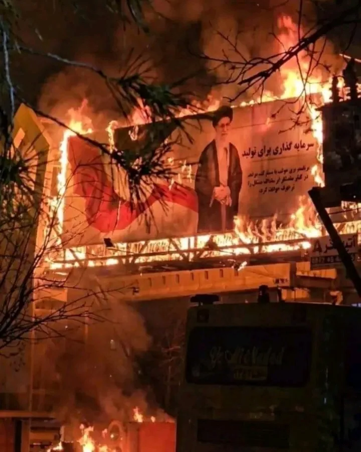 Protest signs calling for change in Iran